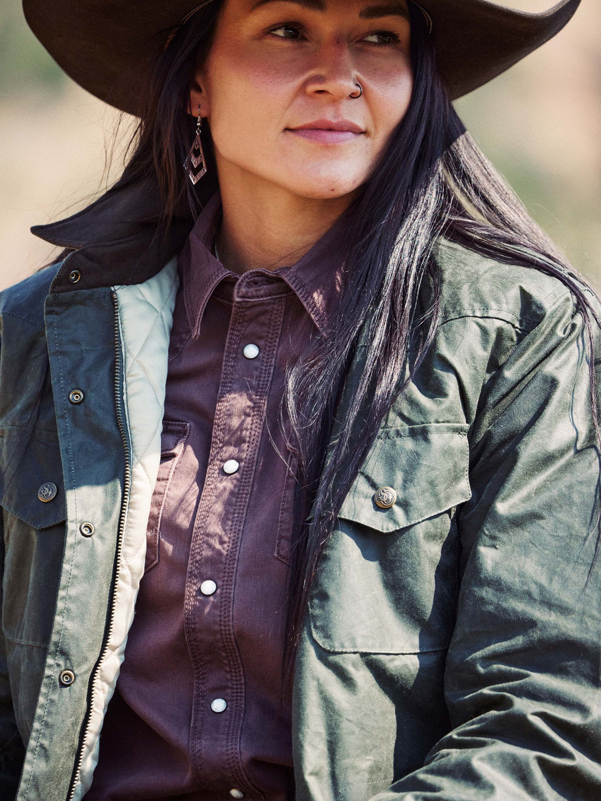 Faded maroon snap-button western shirt collar and front placket detail