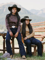 Women wearing faded chestnut snap shirt with pointed yoke and front metal snaps