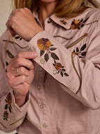 Desert rose embroidered snap shirt close-up with floral cuff and metal snap button