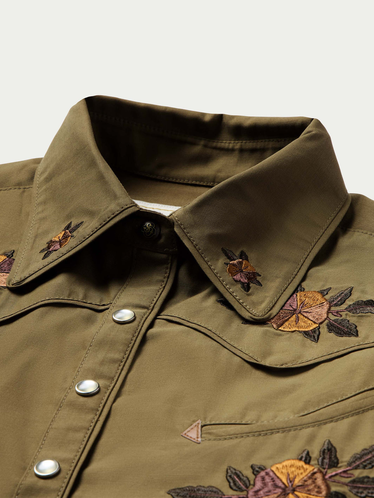 Chestnut-brown embroidered snap shirt with pointed collar and silver snap front