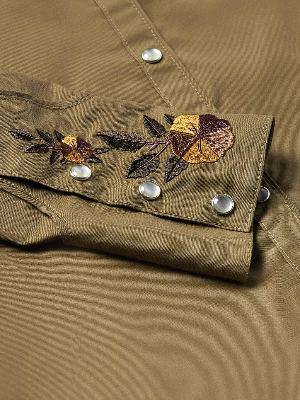 Chestnut-brown snap shirt with floral embroidery across chest and silver snaps