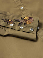 Chestnut-brown snap shirt with floral embroidery across chest and silver snaps