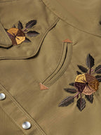 Chestnut-brown embroidered snap shirt collar and pocket yoke with floral thread details