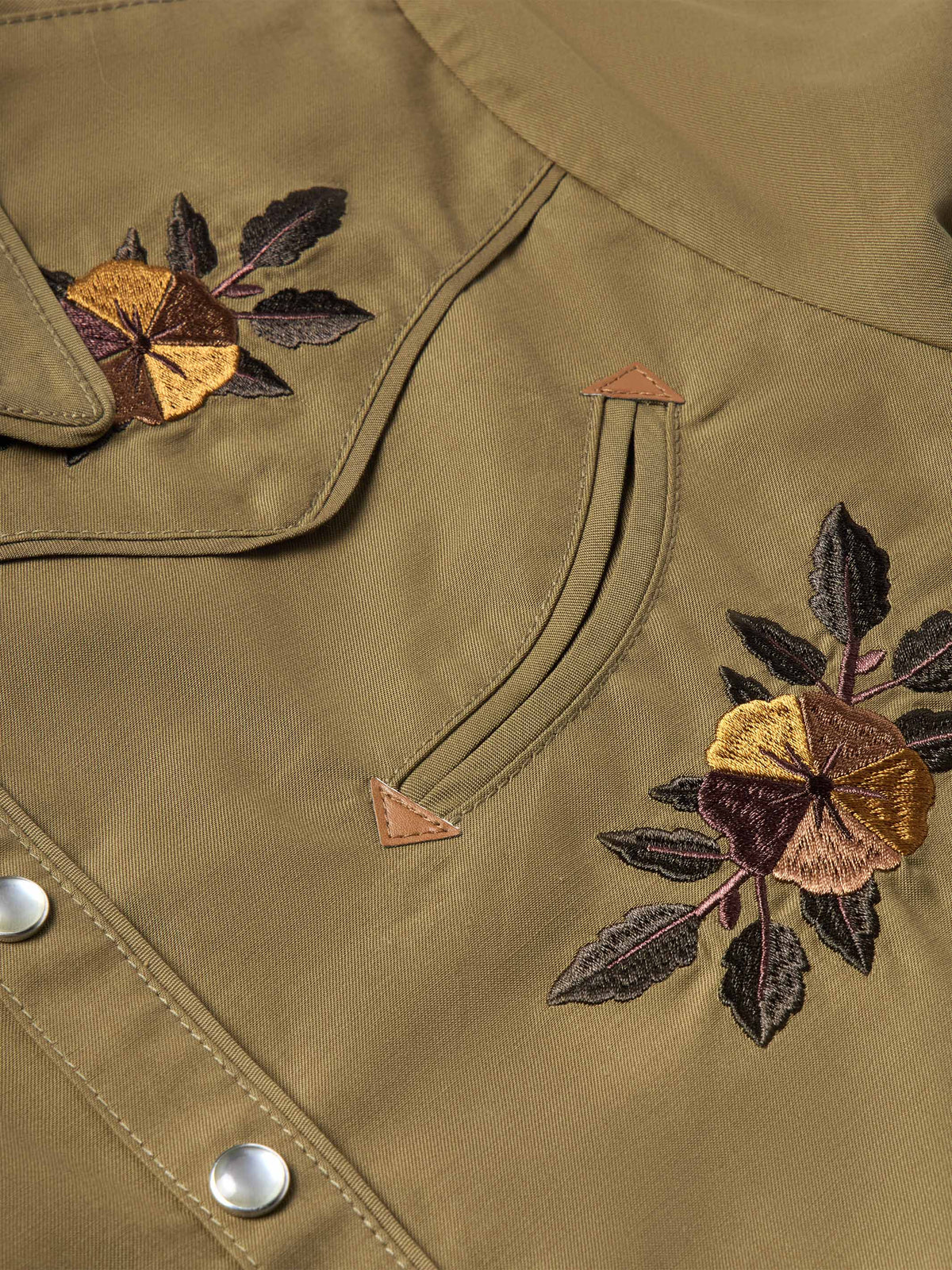 Chestnut-brown embroidered snap shirt collar and pocket yoke with floral thread details