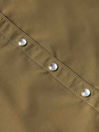 Chestnut-brown snap shirt placket with three silver snaps and stitched seam
