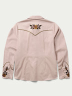 Women’s embroidered snap shirt in desert rose pink with floral chest and sleeve cuffs
