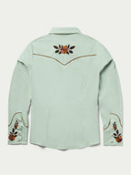 Jade women's embroidered snap shirt back view with yoke floral design and cuffs