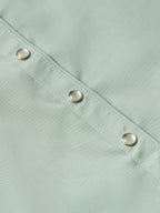 Jade snap-front shirt close-up showing metal snaps along the placket