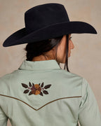 Jade women's embroidered snap shirt back view showing central yoke floral motif