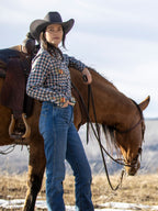 Women’s embroidered snap shirt on model, blue plaid with floral embroidery and snaps