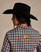 Back of embroidered blue-and-orange plaid snap shirt with floral yoke detail