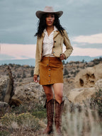 Buttercream suede Medina-style jacket with whipstitch edging and dark button front