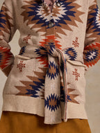 Belted knit sweater in beige with geometric motifs, button front and tie waist