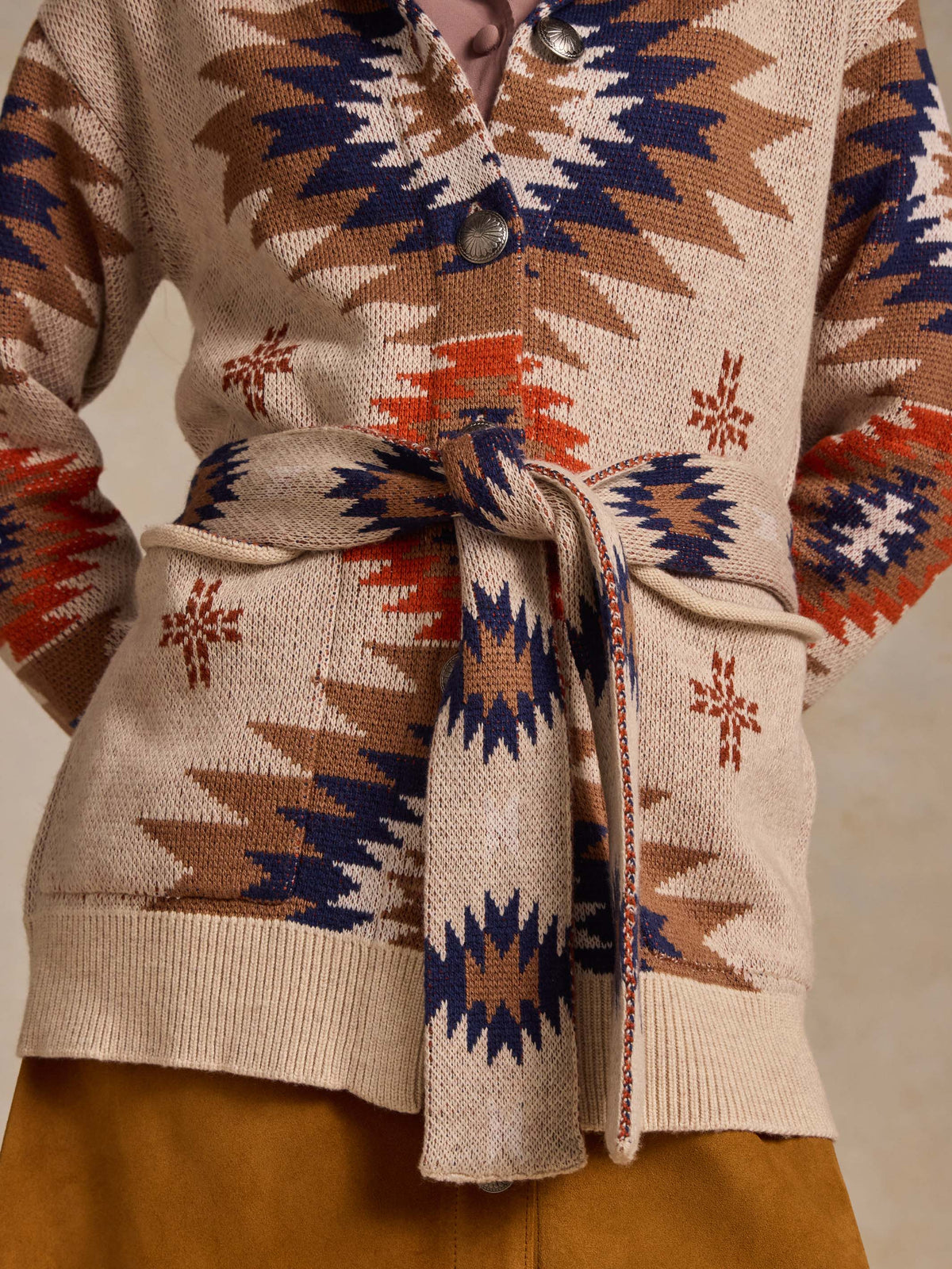 Belted knit sweater in beige with geometric motifs, button front and tie waist