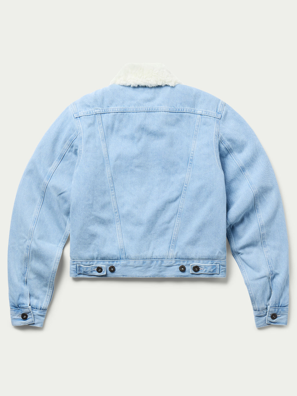 Light wash denim jacket with sherpa lining on collar and hem, buttoned cuffs