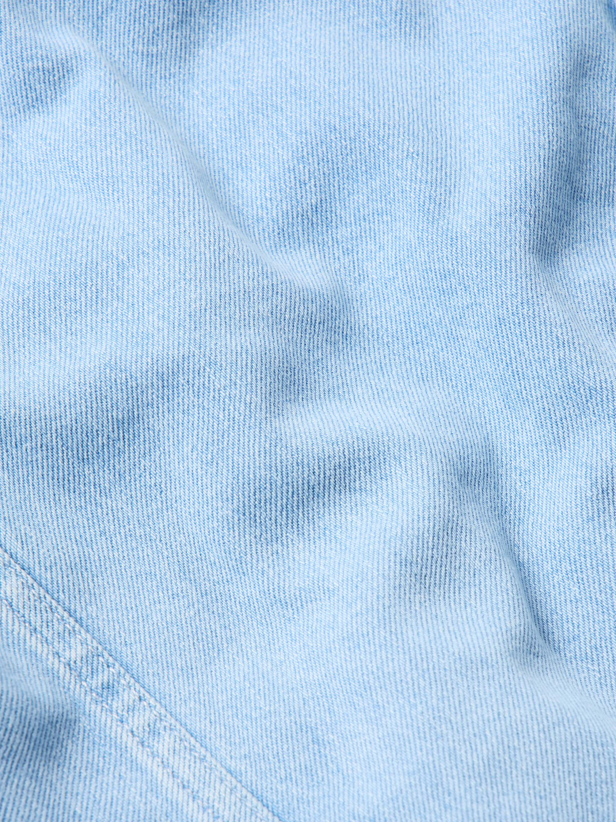 Light wash denim fabric texture for sherpa-lined jacket