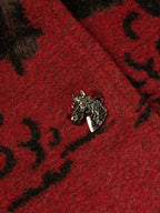 Crimson and dark gray blanket-style coat with metallic animal-shaped button clasp