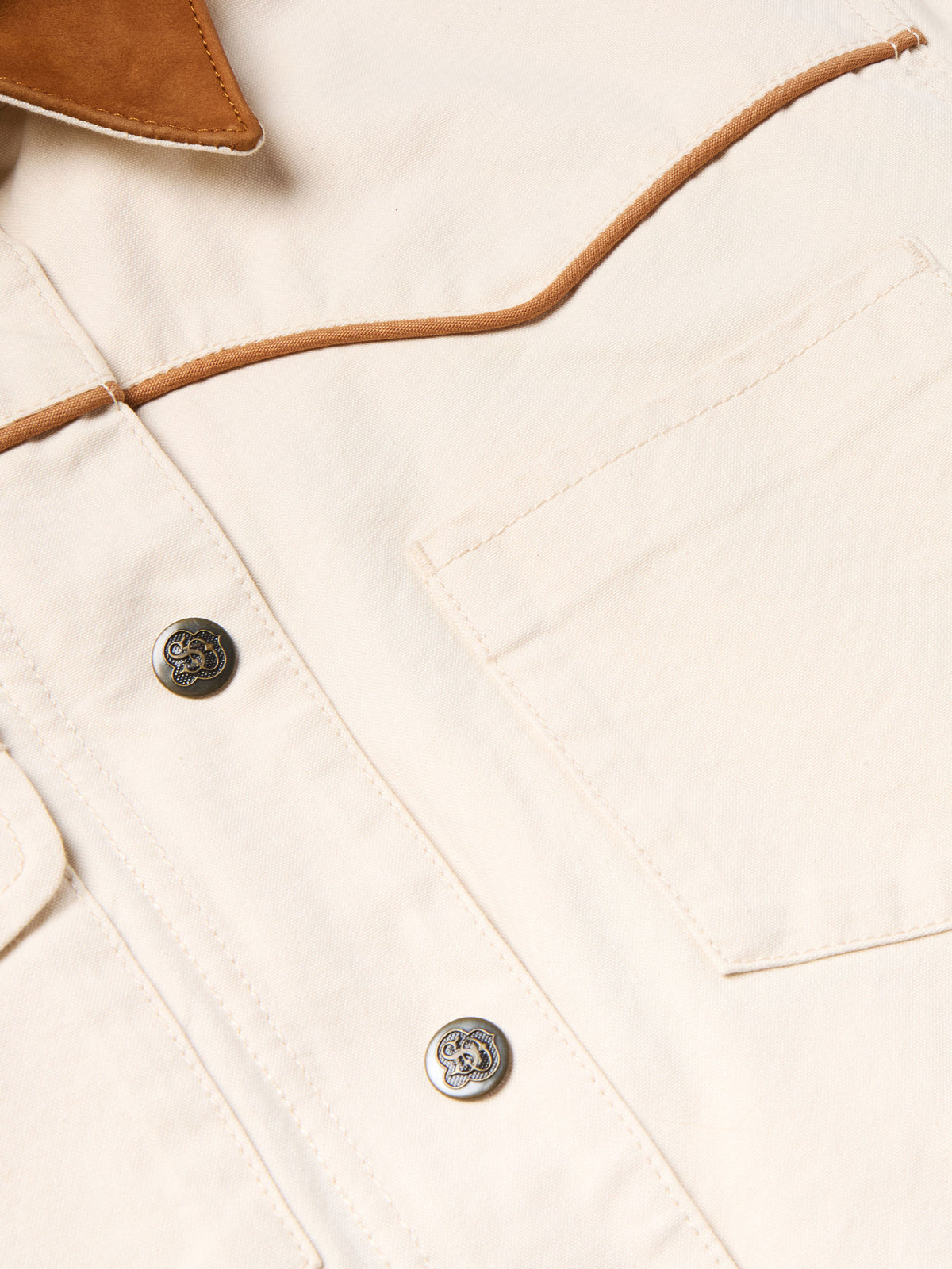 Off-white coat front with snap buttons and stitched placket detail
