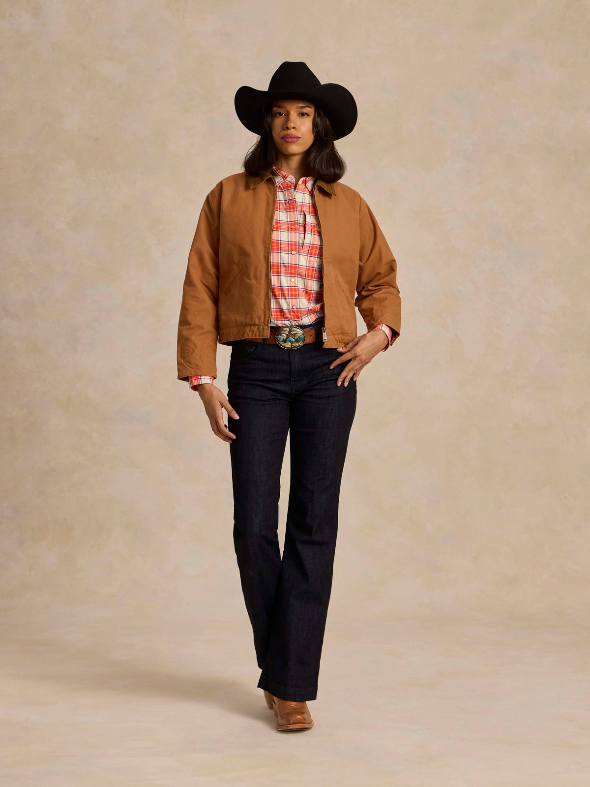 Saddle-brown ranch jacket worn over plaid shirt, full body front view