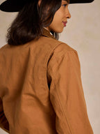 Saddle-brown ranch jacket back with yoke seam and stitched sleeve detail