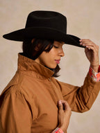 Saddle-brown ranch jacket with high collar and snap buttons, close-up