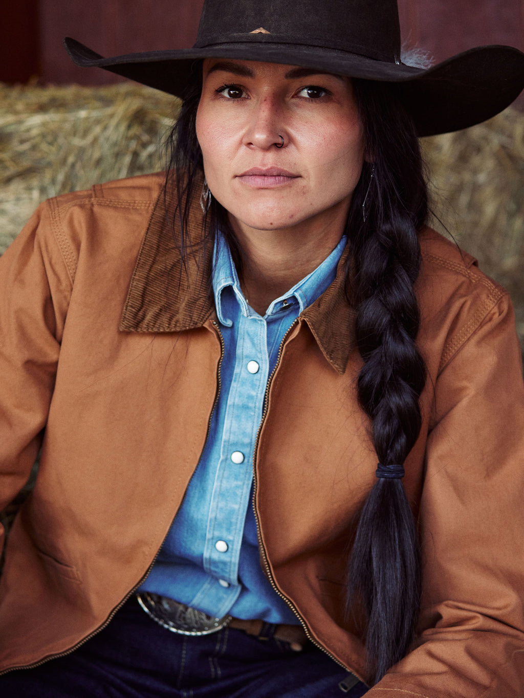 Saddle-brown ranch jacket with snap front and spread collar, close-up at neckline