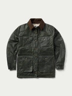 Dark green waxed barn coat with brown collar, front snap placket, and chest pockets.