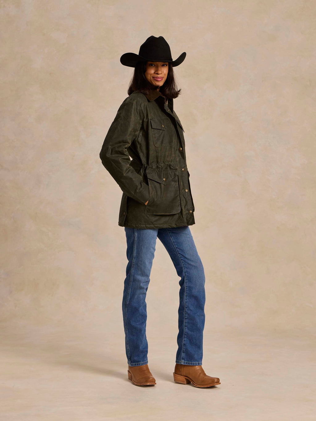 Loden dark green barn coat with button cuffs and chest pockets, three-quarter view