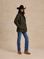 Loden dark green barn coat with button cuffs and chest pockets, three-quarter view