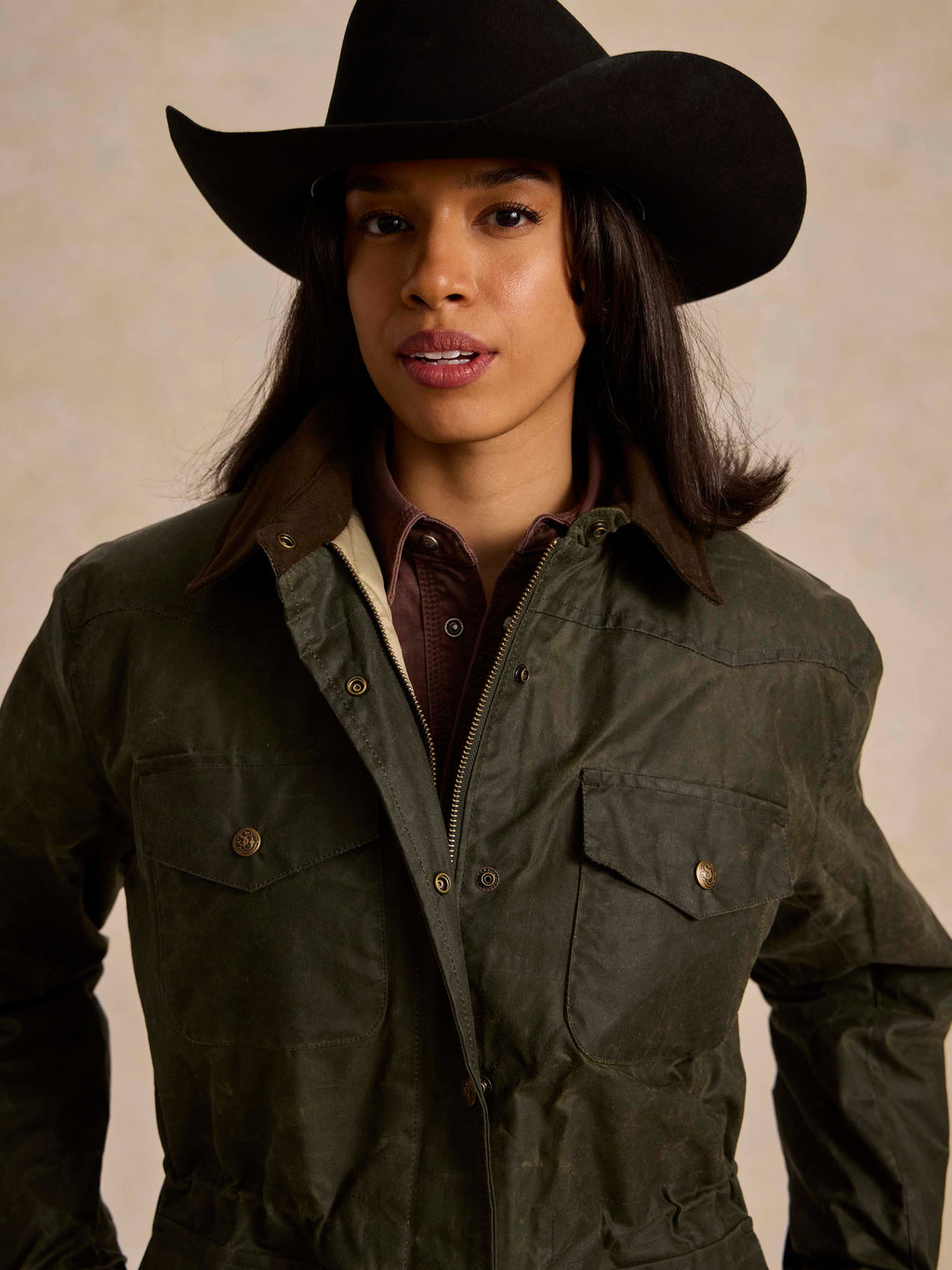 Loden dark green barn coat with cord collar and zip front peeking at neckline