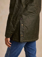 Loden green barn coat with front slit and snap closure, side seam, long sleeves