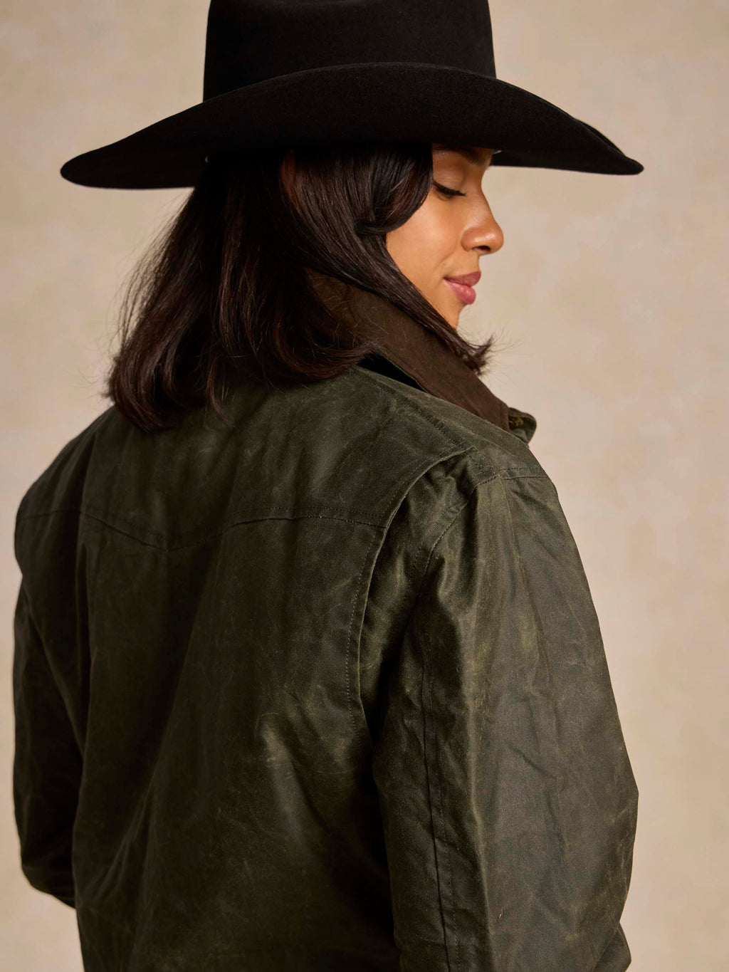 Loden dark green barn coat back view with structured shoulders and button details