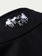 Women's black wool arena jacket sleeve detail with embroidered horse logo
