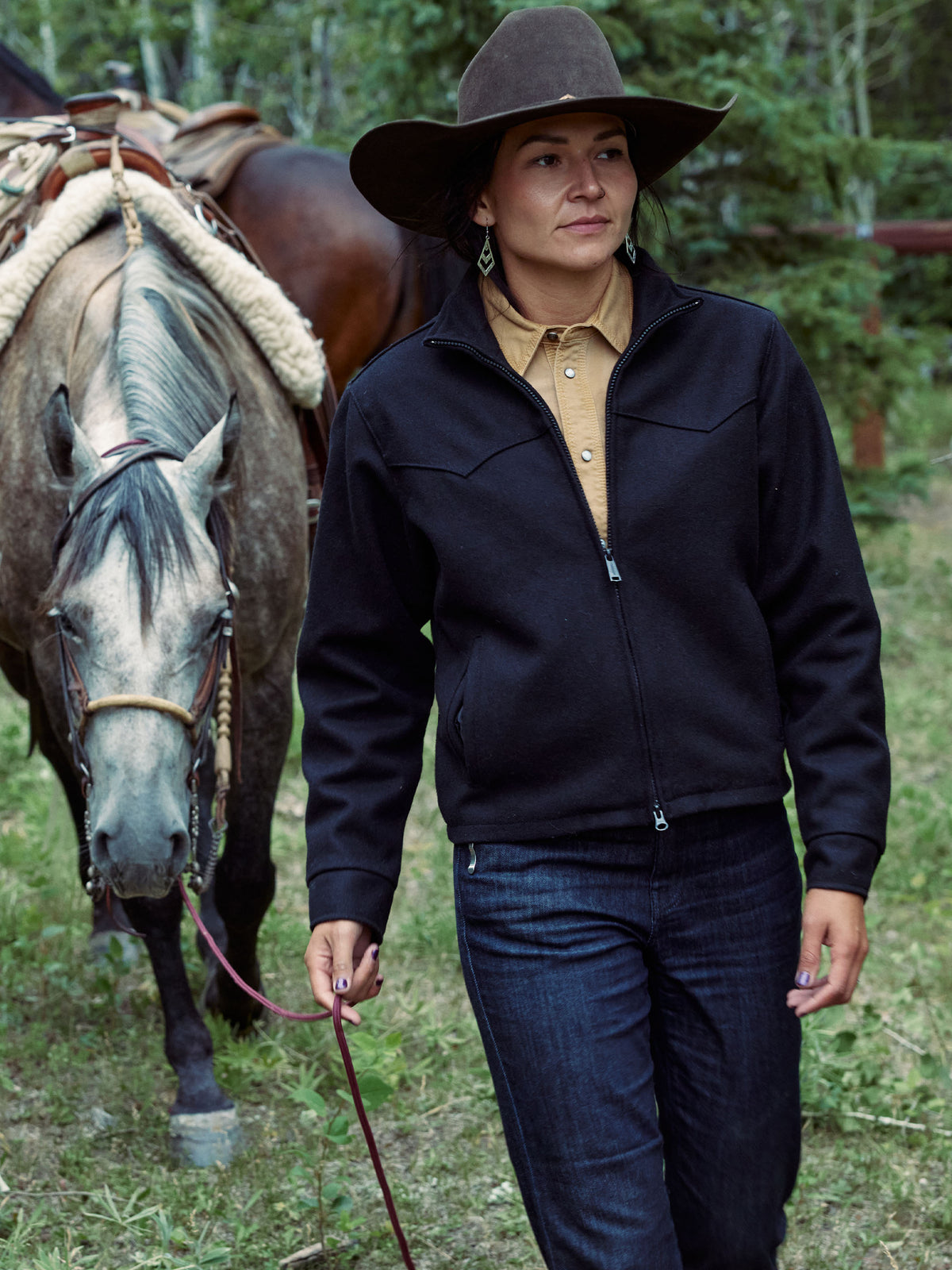 Women's dark wool zip-up jacket with high collar and front zipper