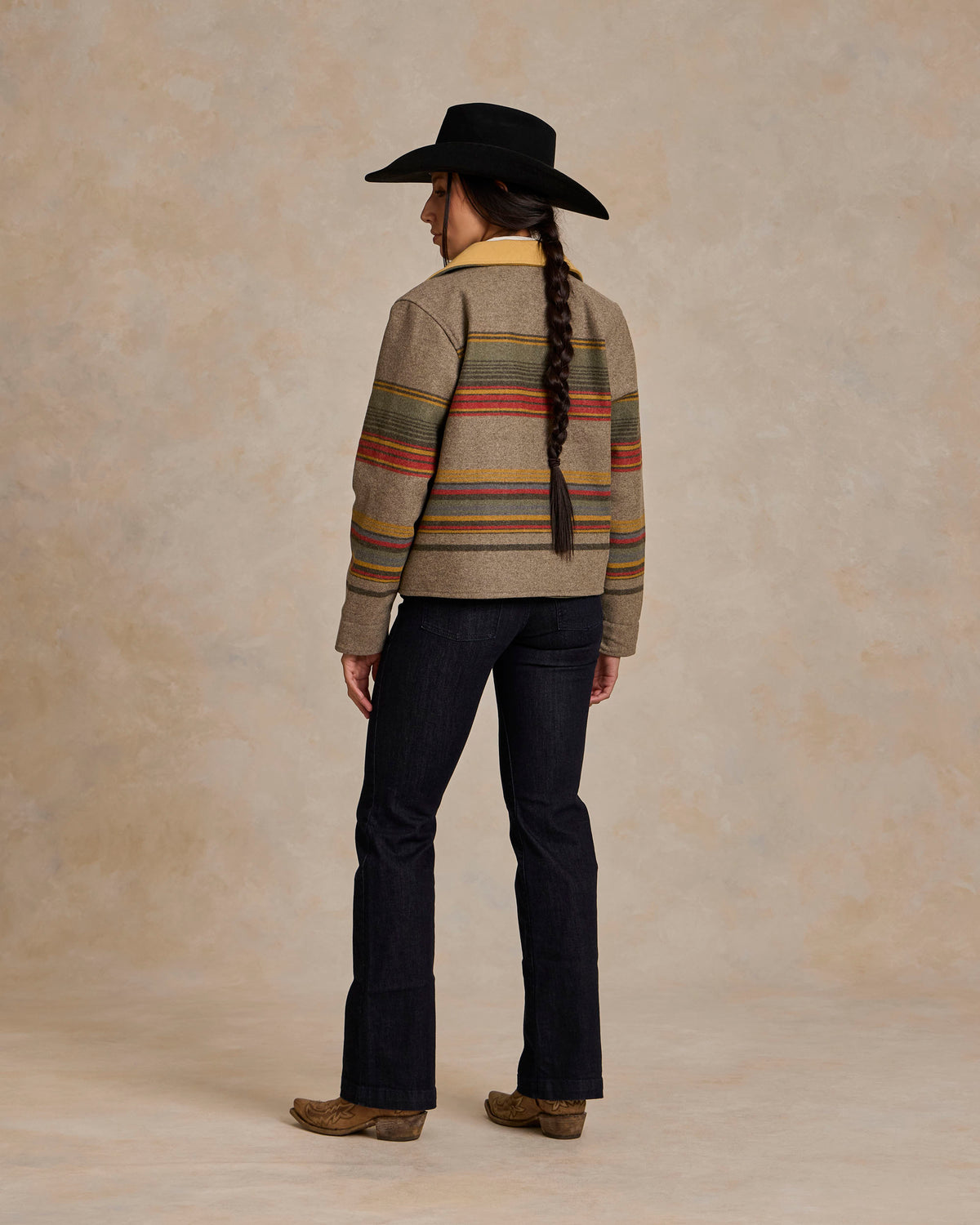 Women’s striped taupe jacket with tan leather-style collar, back view