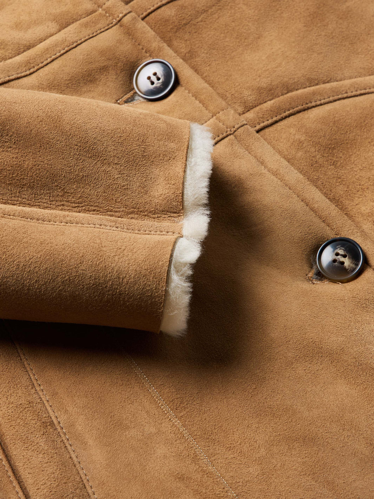 Chestnut suede shearling coat cuff with button closure and white fur trim