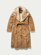 Women’s long chestnut shearling coat with front button placket, belt tie, and fur collar