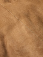 Chestnut suede shearling coat fabric with fine stitching seam detail