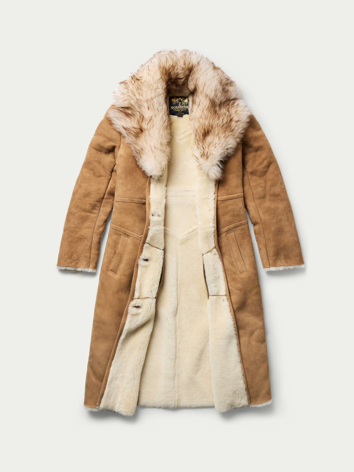 Women’s chestnut shearling coat with fur-lined interior and long button-front design