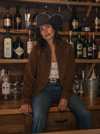 Pecan suede studded jacket on model, full front view with silver studs and zipper