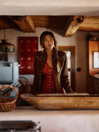 Women’s pecan brown suede jacket with studded button front and side stud accents.