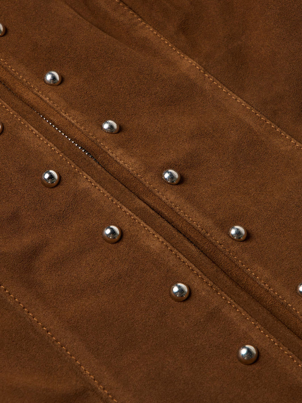 Pecan suede jacket close-up of stitched seams with silver studs