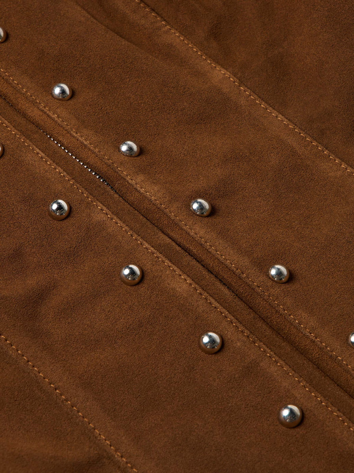 Pecan suede jacket close-up of stitched seams with silver studs