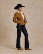 Brown shearling jacket with sherpa-lined collar and button front, worn with dark jeans