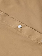 Tan western snap shirt shoulder seam with stitched panel and single snap button