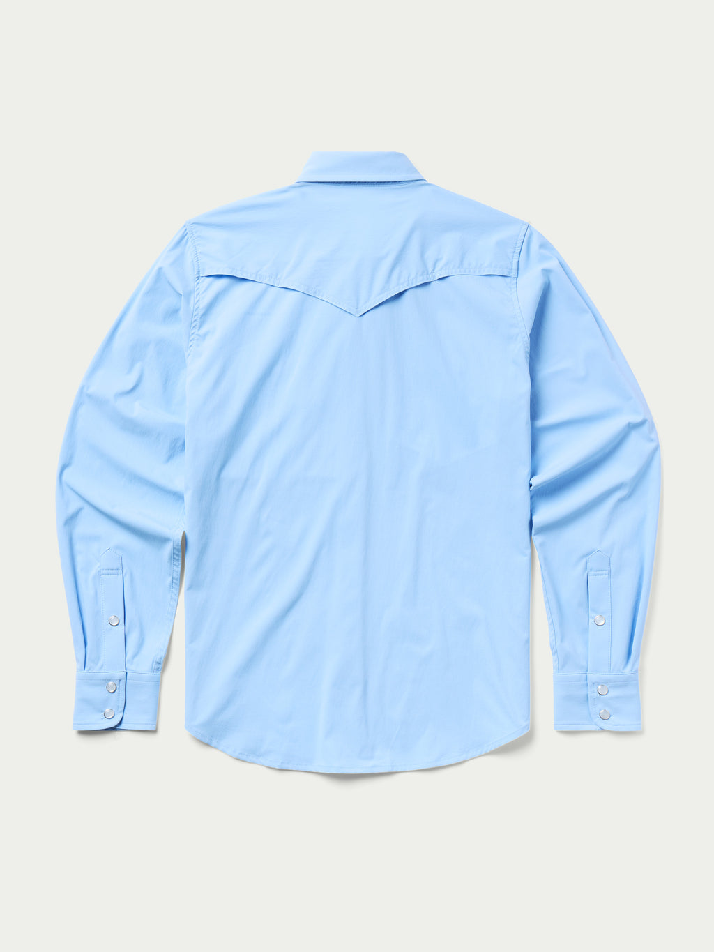 Women’s sky blue Western snap shirt back view with yoke seam and long sleeves