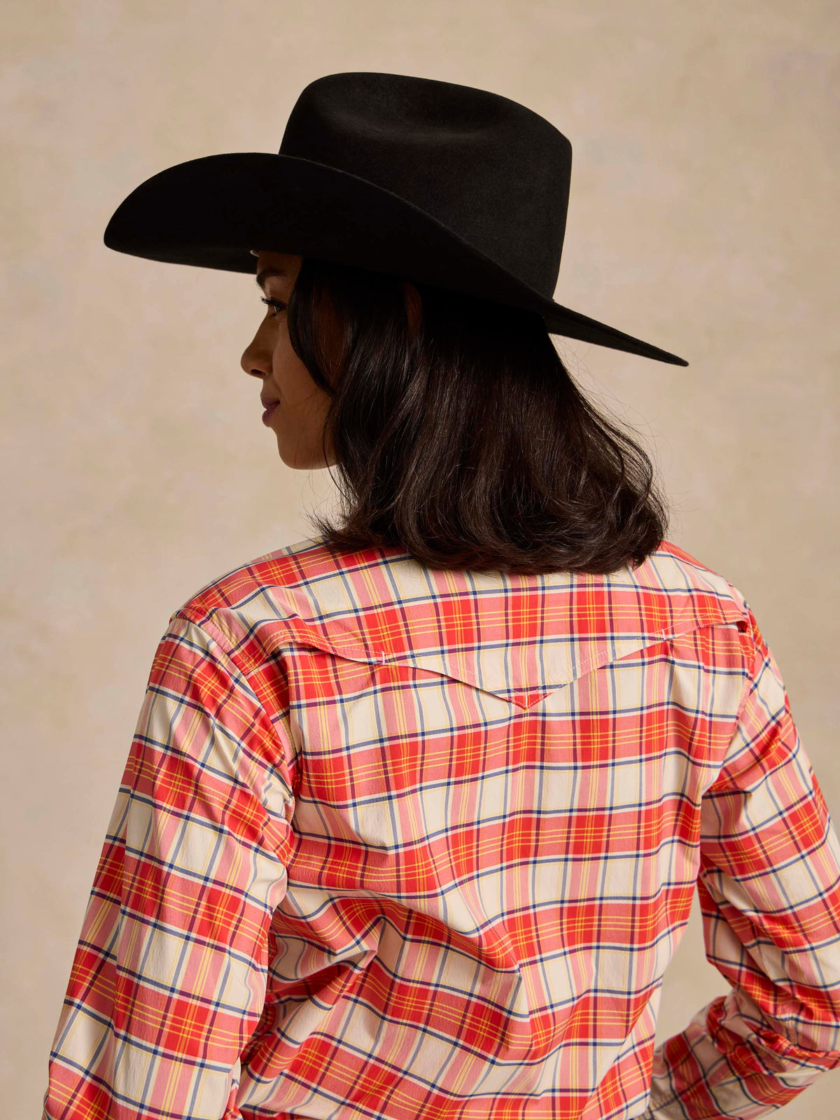 Women’s plaid snap western shirt, red and white, back view with yoke detail