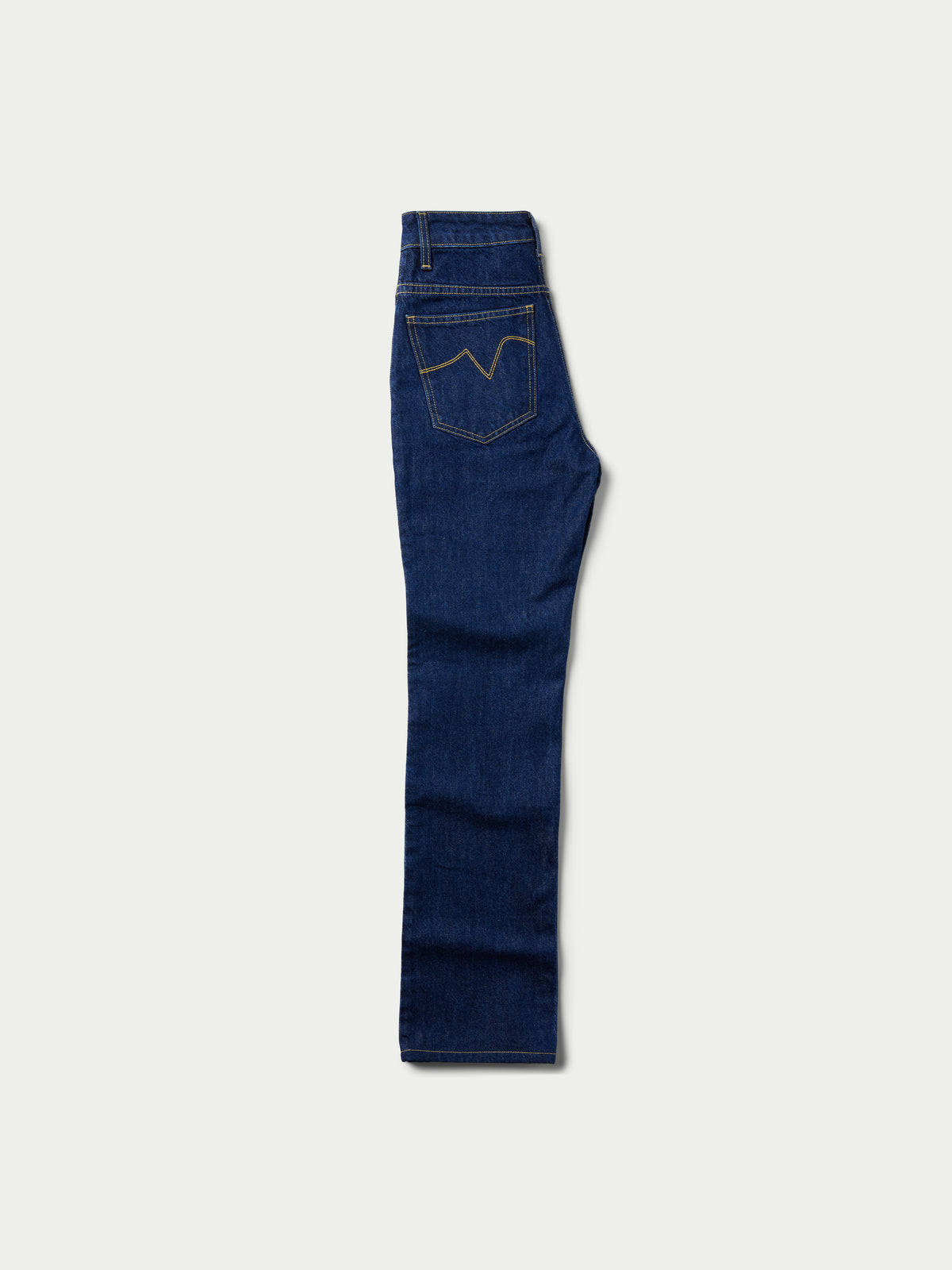 Dark indigo denim jeans shown from the side with stitched seams