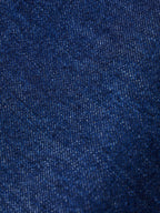Dark indigo denim fabric texture close-up