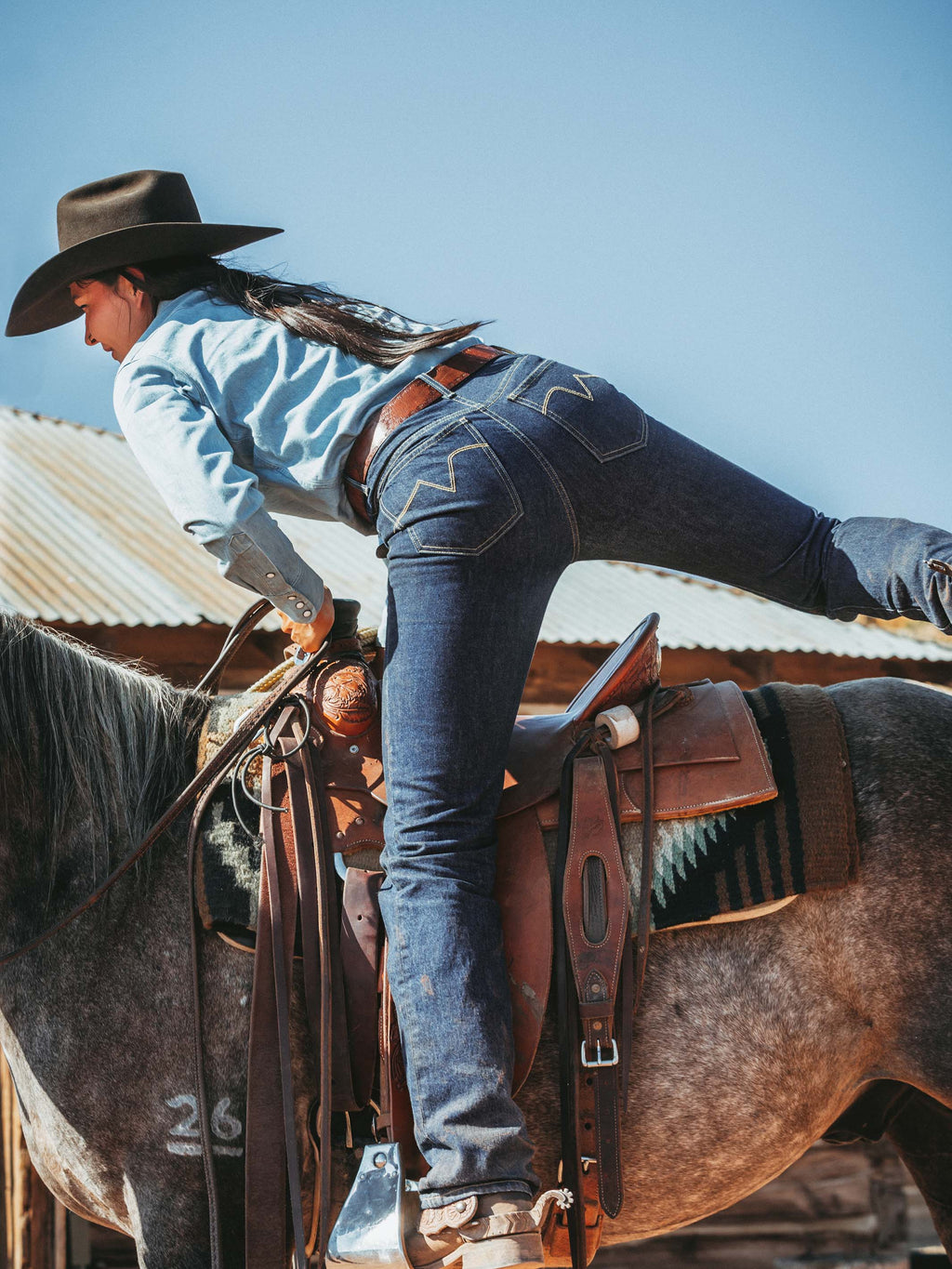 Dark indigo denim jeans with belt loops and five-pocket styling